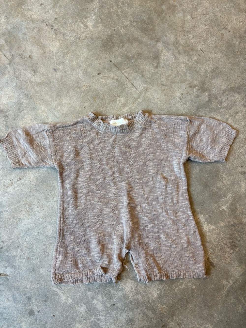 Adored cotton romper “needs repair”